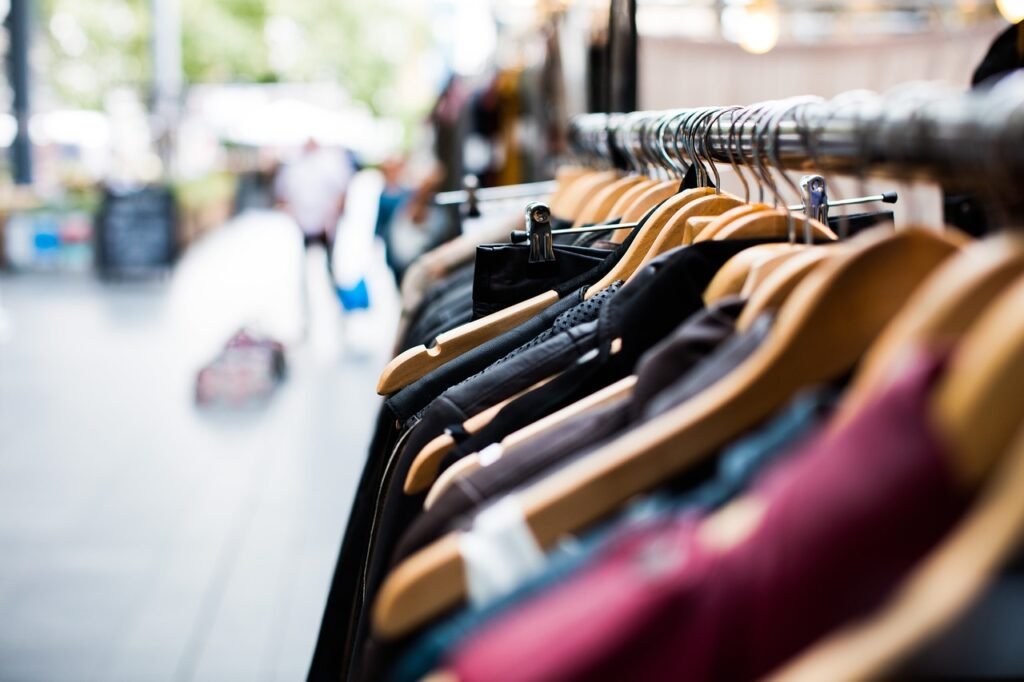 clothing on hangers - How to Do a Pop-Up Shop Outside 