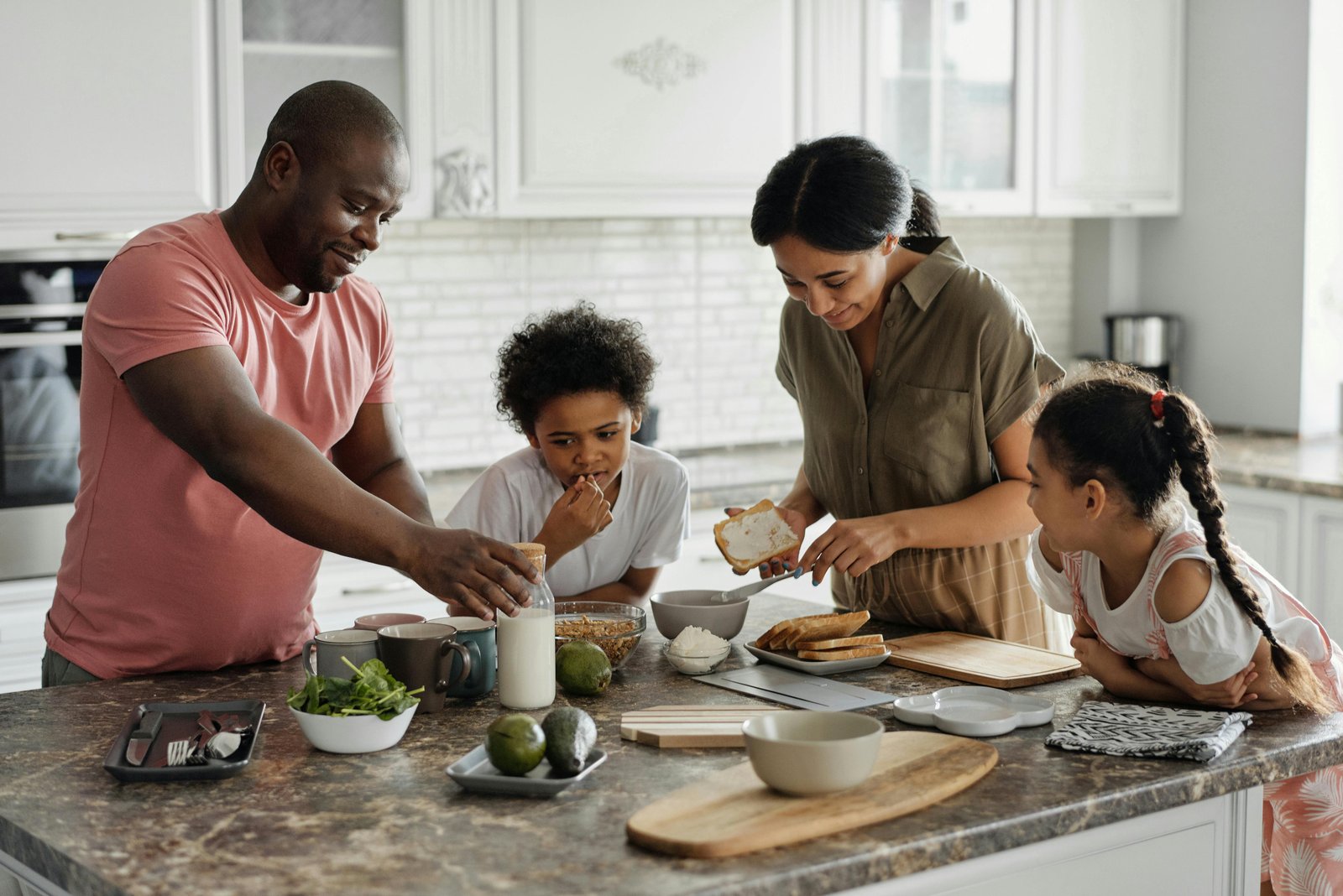 Family preparing a meal together in the kitchen – Family Friendly Activities at Home