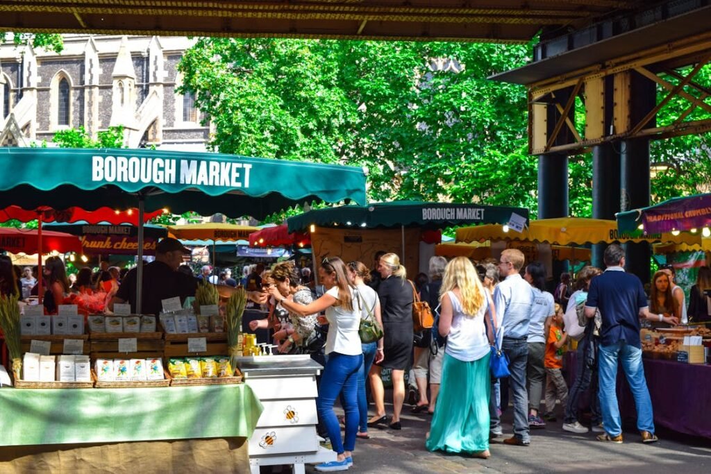 people shopping at a market - a group of people walking in a busy area - Consumer sovereignty and the ethics of recognition