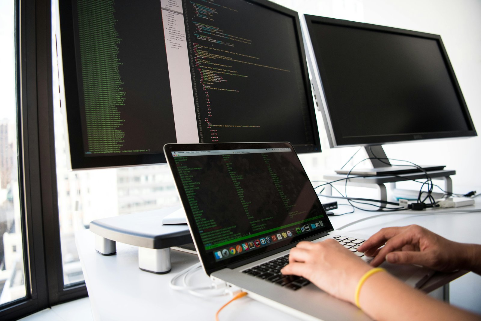 a person typing on a laptop - risk management technologies