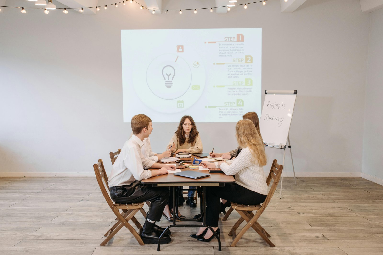 Team discussing Open Door Policy Management in a business meeting setting.