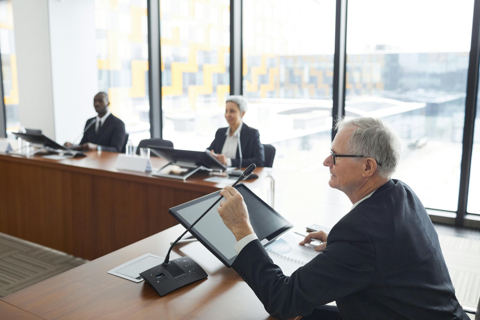 Cross-Functional Teams discussing strategies in a modern conference room.