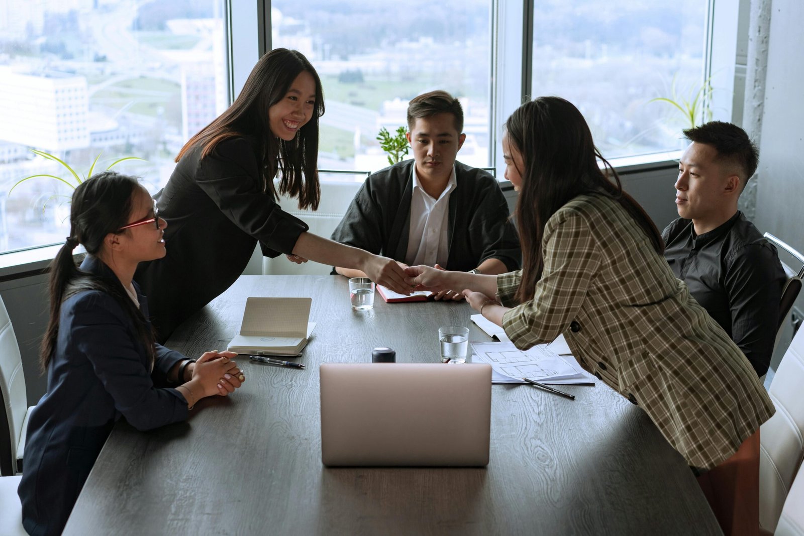 people in a business meeting discussing market share expansion