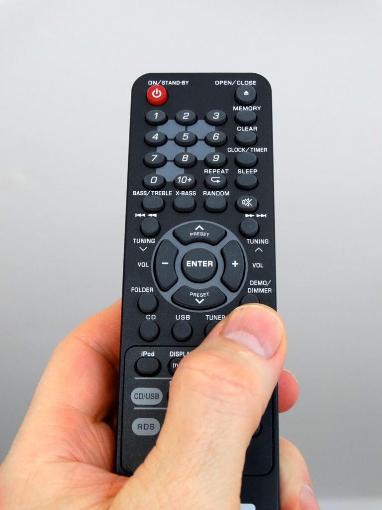 hand holding remote control - comcast dei