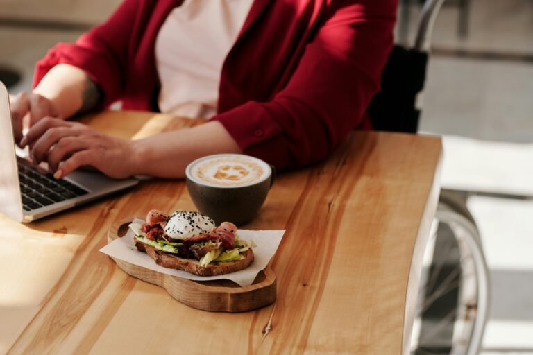 Woman in wheelchair with toast and coffee