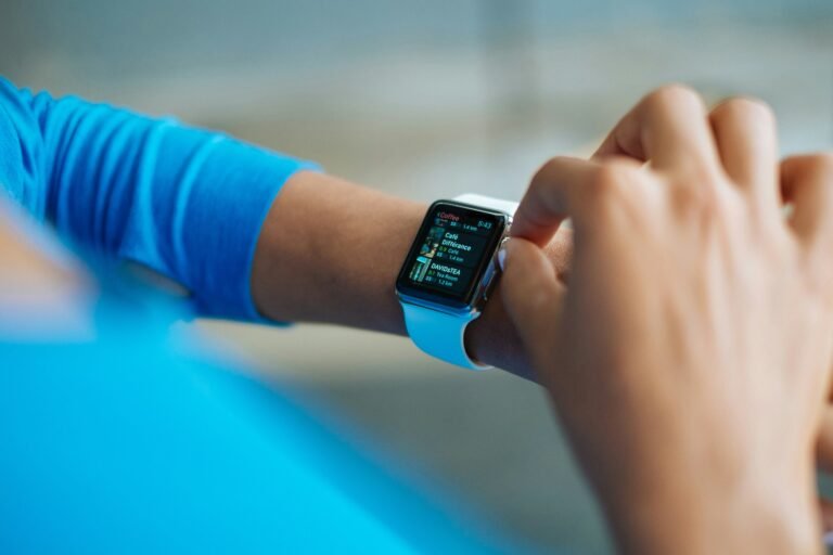 Woman wearing blue with smart watch on her wrist