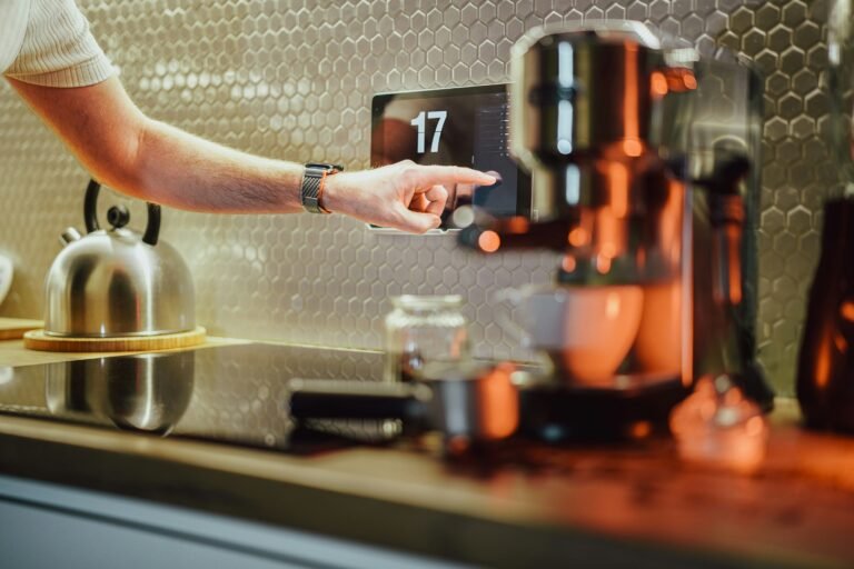 A hand reaching out to press a machine