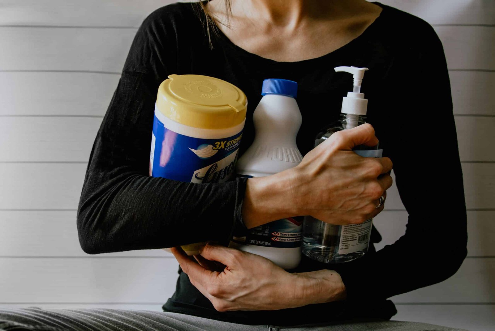 Woman carrying cleaning products