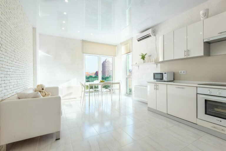 Modern studio apartment with a microwave in the kitchen