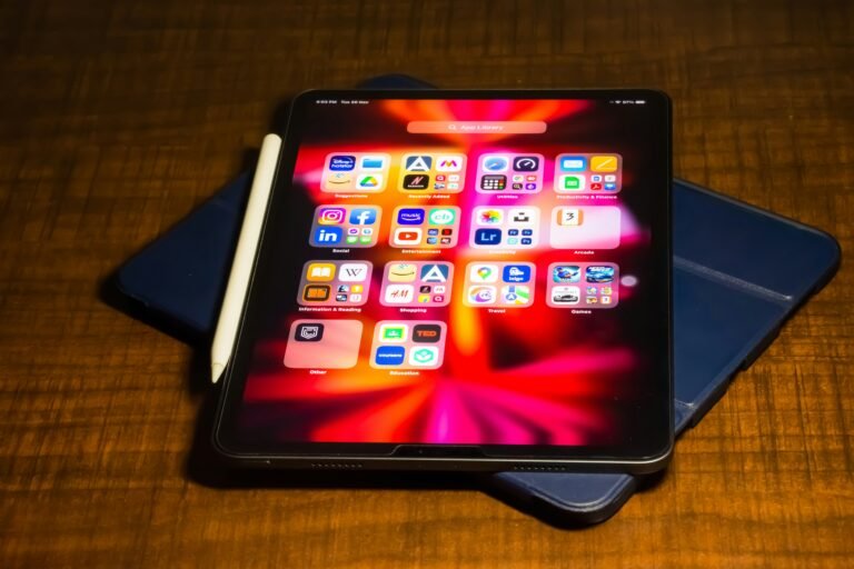 An ipad on a wooden surface