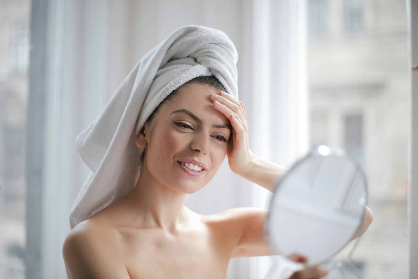 Woman holding up a mirror