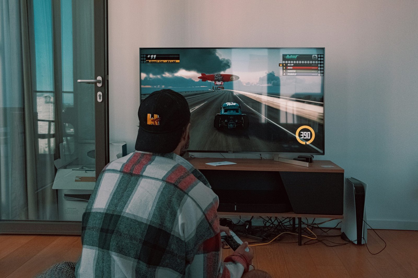 Person playing game on a TV