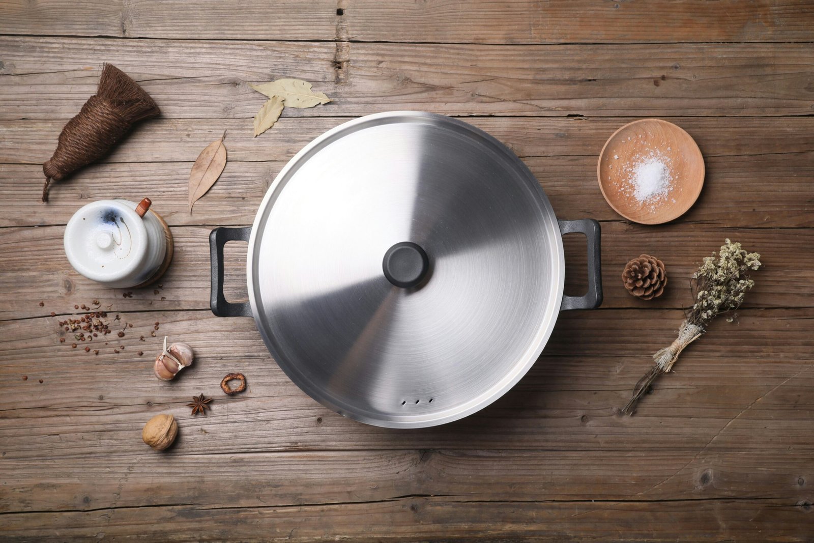 Pot on a table with spices by the side