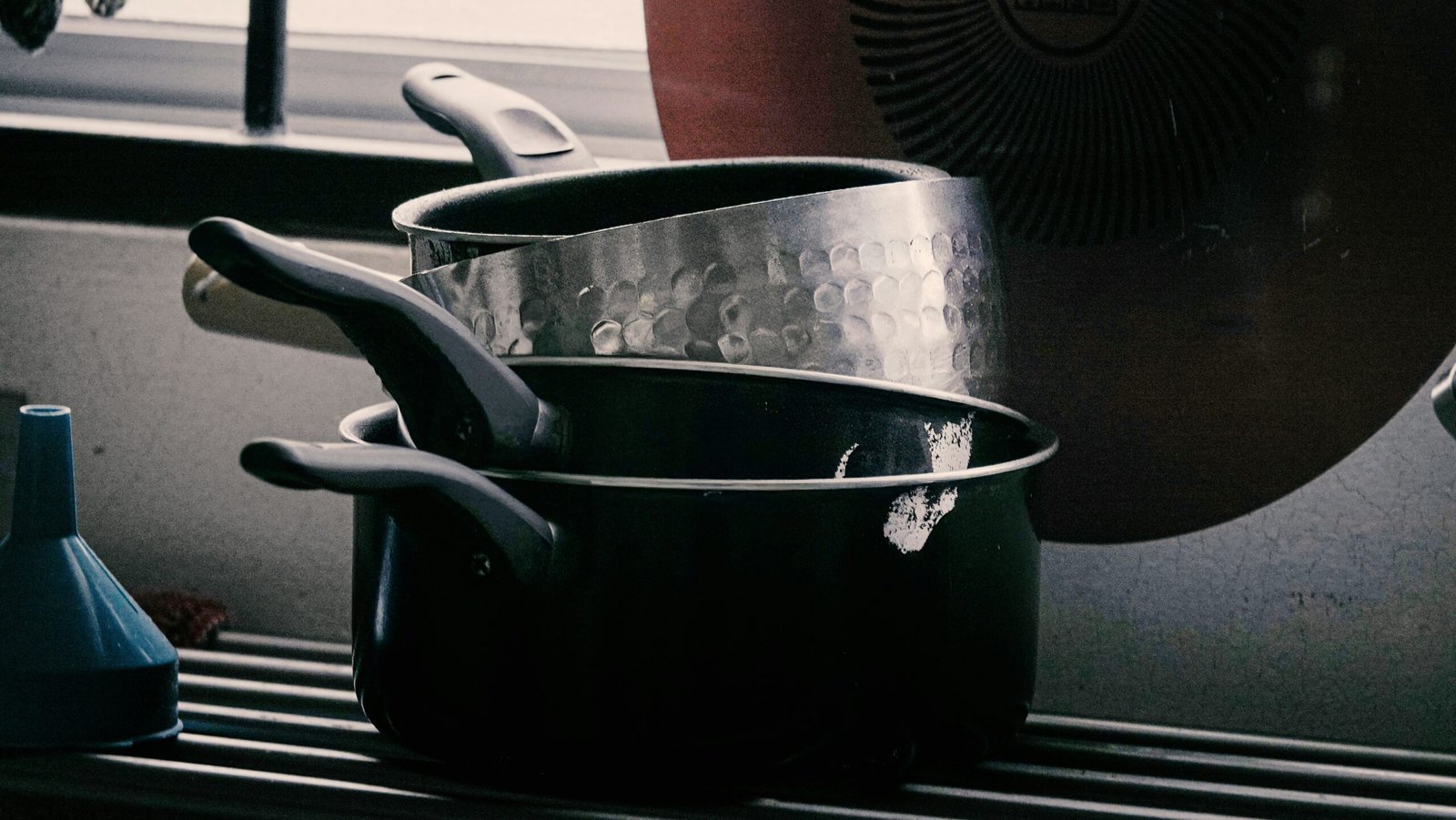 saucepans on a stovetop