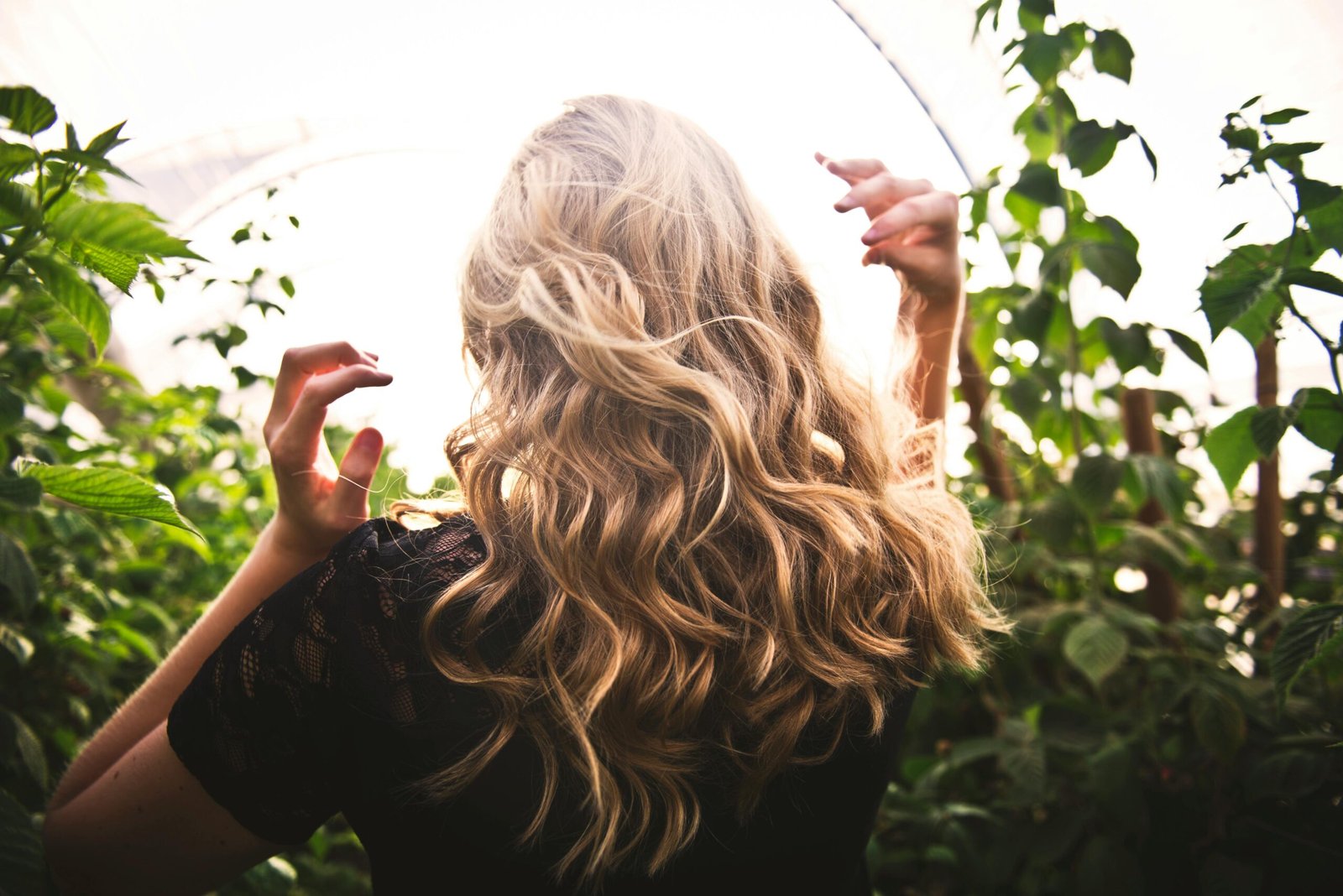 Woman with wavy hair in a field