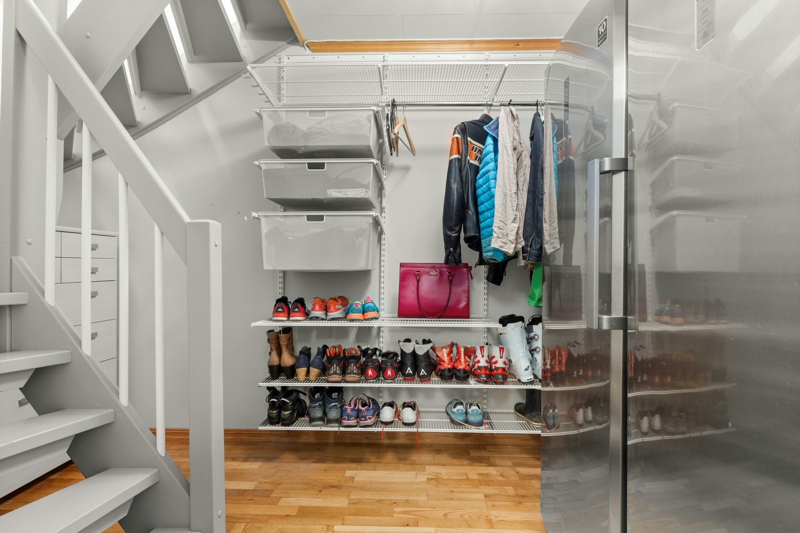 organized closet under stairs